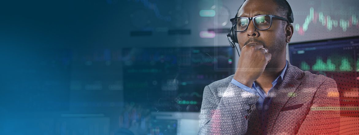 Featured image for article titled "Addressing Compliance Challenges with Managed SOC" showing a male analyst with glasses on looking at a screen with his hand on his chin as if in thought.